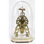 A late Victorian brass skeleton clock, the applied silver chapter ring bearing Roman numerals,