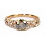 A 14ct rose gold and diamond ring, the central orange/brown diamond weighing approx 1.01ct within