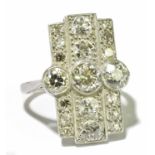A platinum and diamond plaque ring in the Art Deco taste, the central three rubover set old cut