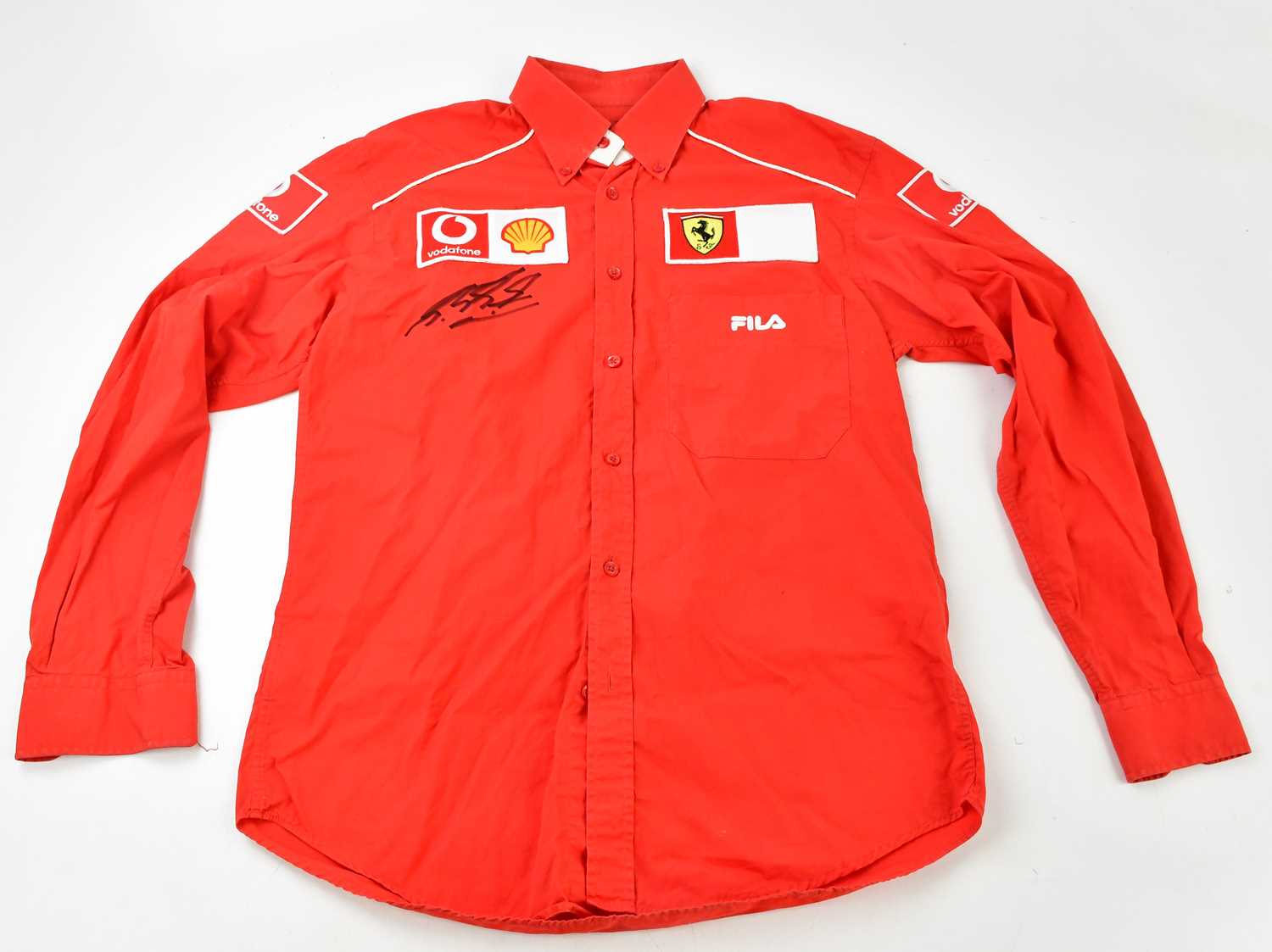 MICHAEL SCHUMACHER; a signed FILA Ferrari button up shirt, signed to the front, size S. Condition