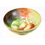 LIMOGES; a large hand painted bowl, decorated with fruit, height 15cm, diameter 36cm.