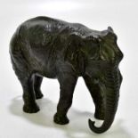 A bronze figure of an African elephant, stamped to the underside, Deschuetzt, height 13cm.