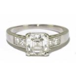 A platinum and diamond solitaire ring, the central asscher cut stone weighing approx. 1.5ct, with