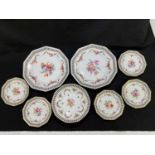 SCHUMANN; a set of eight floral decorated plates, largest 26cm.