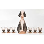 IN THE STYLE OF HOFFMAN; an Art Deco pale pink tinted and grape and leaf decorated decanter and