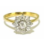 An 18ct yellow gold and diamond flower head ring, the nine old cut diamonds totalling approx. 1ct,