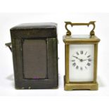 A 19th century French brass cased carriage clock, the enamalled dial set with Roman numerals, height