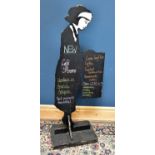 A cafe blackboard in the form of a waitress, height 160cm.