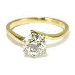 An 18ct yellow gold and diamond solitaire ring, the six claw set round brilliant cut stone approx.