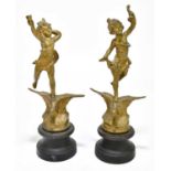 A pair of bronzed spelter figures representing children standing on eagles, on socle bases, height