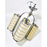 A decorative Art Deco chrome plated hanging ceiling light with four curved glass shades, with etched