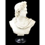A decorative resin bust of Apollo on socle, height 56cm. Condition Report: Some casting imperfection