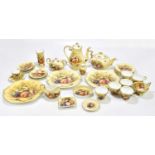 A tea service decorated in the 'Orchid Gold' pattern.