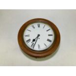 A late Victorian mahogany framed circular wall clock with single fusee movement and Roman numerals