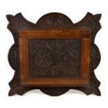 A late Victorian possibly Macclesfield school of carving candle holder, 50cm x 45cm.