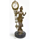 A circa 1900 spelter mystery clock with female figure holding the balancing timepiece and with