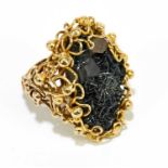 IN THE STYLE OF JOHN DONALD; a 9ct yellow gold crystalline hematite with quartz crystal unusual