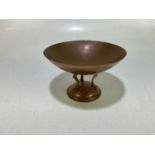 LINTONS; a copper and brass bowl, stamped to the underside, height 13cm.