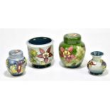 MOORCROFT; four pieces, decorated in the 'Arum Lily' pattern, to include two ginger jars and covers,