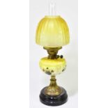 A Victorian oil lamp, the yellow glass shade with etched decoration depicting butterlies and