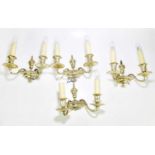 Four silvered metal twin branch wall lights with beaded decoration, height 30cm.