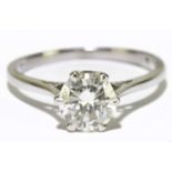 An 18ct white gold diamond solitaire ring, the six claw set round brilliant cut stone, clarity I1,