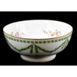 A 19th century hand painted footed bowl decorated with floral sprays, bears gilt initial B3 to the