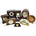 A collection of various mantel clocks to include a walnut and ebonised example.