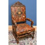 A late 19th century Continental, probably Dutch, carved oak and embossed leather armchair, with