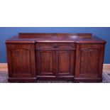 A large Victorian mahogany inverted breakfront sideboard, width 214cm.