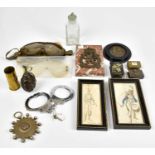 A collection of militaria accessories, including a deactivated grenade, shell casing, Belgian Army