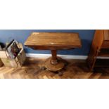 A Victorian rosewood fold over tea table, on paw feet, height 74cm, width 93cm, depth 47cm,