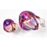 JOHN DITCHFIELD; two iridescent glass paperweights modelled as pigs, length of largest example 14cm,