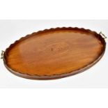 A Victorian inlaid mahogany twin handled tray of oval form with galleried edge, the central inlaid