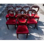 A harlequin set of eight Victorian mahogany balloon back dining chairs on turned supports (8).