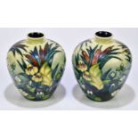 MOORCROFT; a pair of 'Bull Rush' pattern vases, height 18cm.