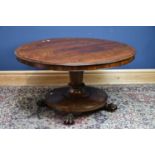 An early Victorian rosewood breakfast table, the circular tilt table above substantial central