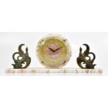 An Art Deco marble mantel clock, the circular dial set with Arabic numerals, flanked by a pair of