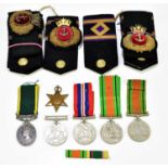 A quantity unnamed WWII medals plus a Territorial Efficiency Medal named to Pte R. Stockton Cheshire