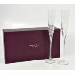 ASPREY; a cased pair of glass flutes with etched decoration, length 40cm, boxed, and with Asprey