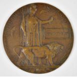 A WWI bronze memorial plaque awarded to Joseph Bradley.