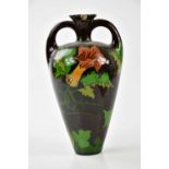 ROZENBERG; a twin handled Art Pottery vase with floral decoration, height 26cm (af) Condition