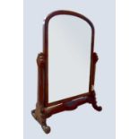 A Victorian mahogany cheval mirror of small proportions with scrolling feet, height 120cm, width