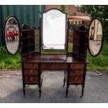 LAMB OF MANCHESTER; a good Edwardian walnut seven drawer kneehole dressing table, with triple mirror