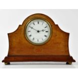 An Edwardian inlaid mahogany mantel clock, the arched top above the enamel dial set with Roman