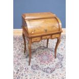 A 19th century marquetry inlaid rosewood roll top desk, with pull-out slide and three internal