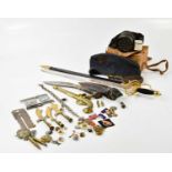 A mixed group of militaria items comprising a cased gas mask, an RAF beret, various medals and