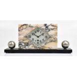 An Art Deco marble and slate mantel clock, the silvered dial set with Arabic numerals, flanked by