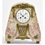A French Art Deco mantel clock with arched top, with applied brass floral sprigging and basket