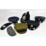 Three RAF caps, Argyll & Sutherland caps, etc, also an Elizabeth II police helmet.